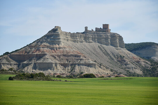 Ancient Castle ruins atop mesa near Sora under blue sky