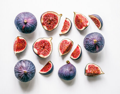 Creative arrangement of fresh whole and sliced figs