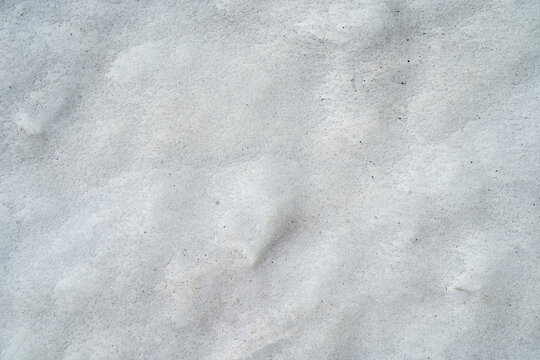 Snow texture background with subtle patterns and light shadows