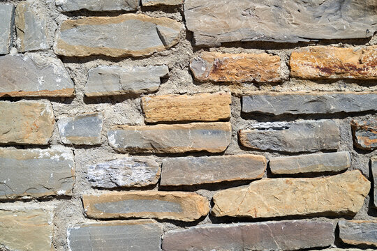 Textured stone wall with various colors and shapes