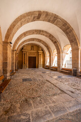 Obraz premium Arched stone cloister corridor at San Millan de Yuso monastery