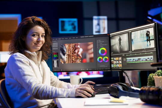 Portrait of jolly video editor using special effects and editing software packages to upgrade footage shot by production teams. Happy videographer finishing project in multimedia agency