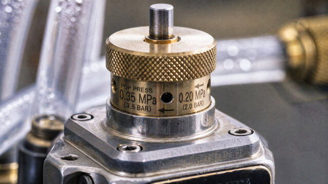 Pressure relief valve mounted on liquid cooling distribution block
