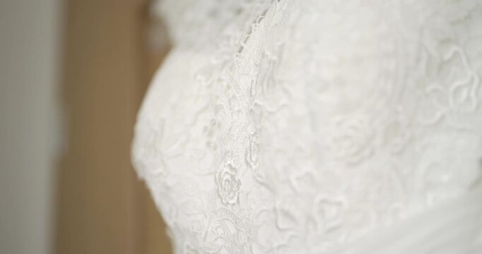 Close-up of white lace fabric with delicate textured detail