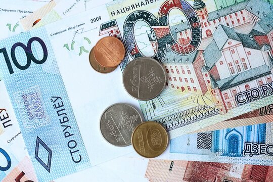 Belarusian ruble money bills and coins on table. Belarus cash of BYN currency close up