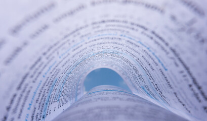 Fototapeta premium Open Book Pages Curved into Abstract Tunnel Shape
