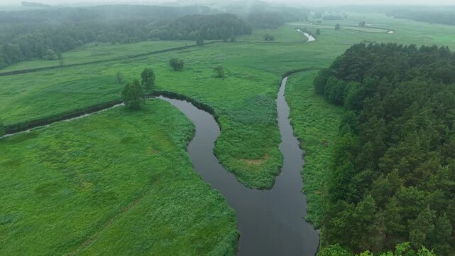 River Confluence &ndash; Parallax Right Tilt Down Wide Aerial Flight Over Watershed