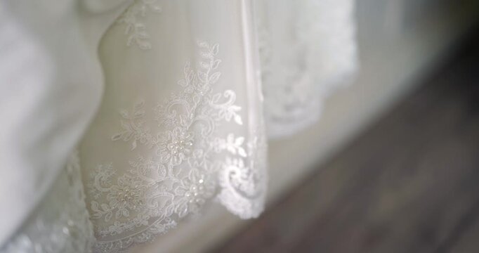 Sheer white lace curtain in soft natural light