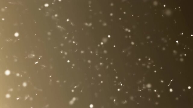 Golden bokeh particles floating on a soft warm brown background