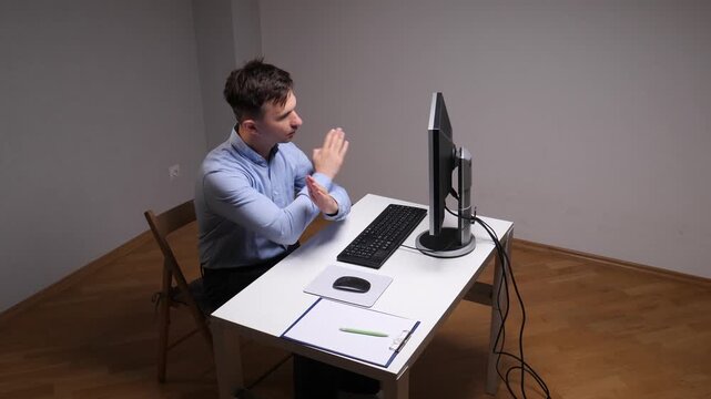 Employee sitting at a desk in a plain office setting, holding hands together in a prayer gesture refusing to work, symbolizing stress, faith, and work life balance challenges