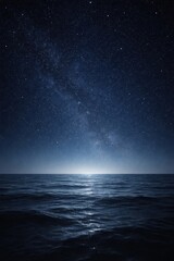 Obraz premium Serene ocean under starry sky.