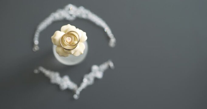 Cream floral ornament in cup on dark background