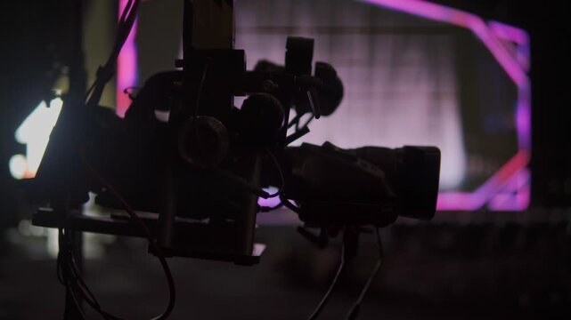 Silhouette of professional broadcast camera on crane