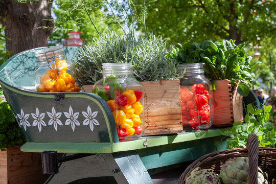 capsicums and chilis and peppers on a traditional produce cart display at Tivoli Gardens in spring in Denmark