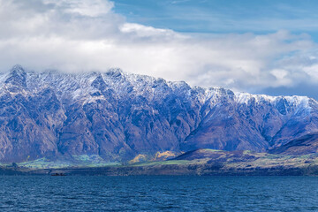Obraz premium Snow Covered Mountain Range Across Lake