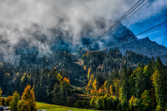 Zugspitze Cable Car Through Misty Alpine Forest