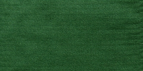 Fototapeta premium Green cloth fabric texture background. Seamless pattern material. Plain simple festive wallpaper design.