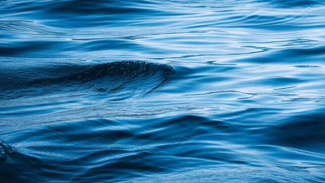 Abstract blue water ocean wave texture calm sea surface reflective liquid pattern cool ripple background tranquil marine nature seascape motion