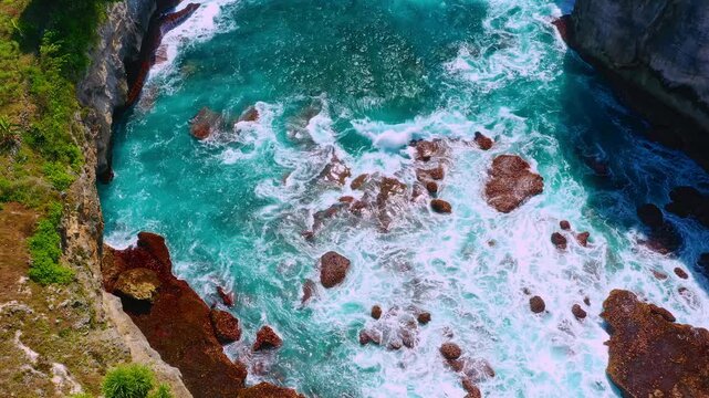 Bali famous landmark and popular travel destination Broken beach with stone arch above ocean and unique pool in form crater on the island Nusa Penida, Bali, Indonesia 4K