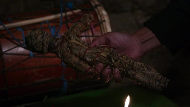 Voodoo Doll with Traditional Drum in Background