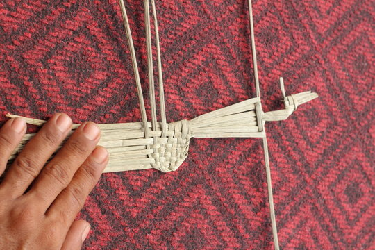 The process of making suket puppets, which are made from a type of grass called mendong