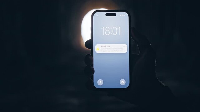 Smartphone Showing AMBER Alert Notification Inside Dark Tunnel, Cinematic Public Safety Scene About Missing Child Emergency and Community Awareness