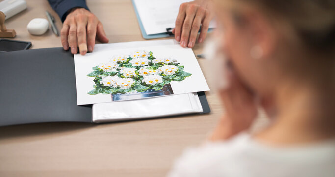 Funeral Director Supports Female Client Thoughtfully Planning Personalized