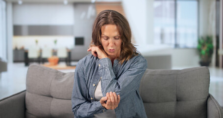 Mature Woman Soothing Elbow Joint Pain With Gentle Therapy