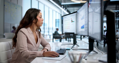 Young Compliance Officer Monitors Risk Data On Computer