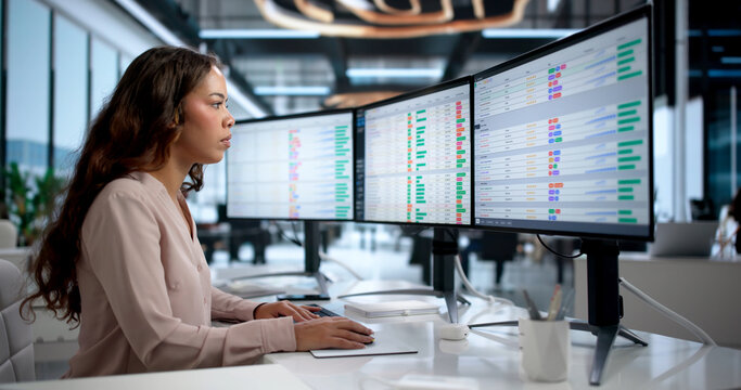 Young Woman Enters Medical Billing Codes On Computer
