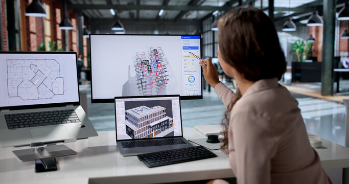 Young Female Mechanical Engineer Uses 3D BIM Software