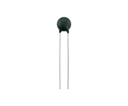 Small ceramic disc capacitor electronic component with leads isolated on transparent background set.