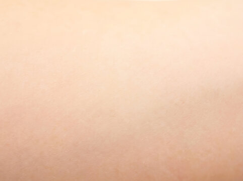 Close up macro view of peach toned skin texture gradient image