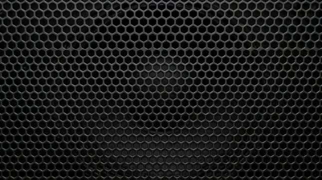 Black metal perforated sheet with hexagonal holes abstract background texture