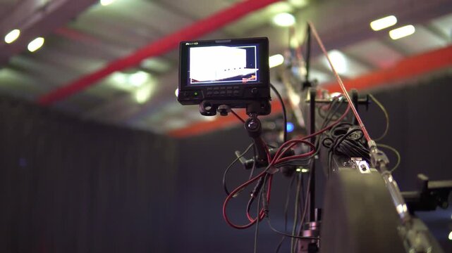 Professional camera crane monitor operating during live event