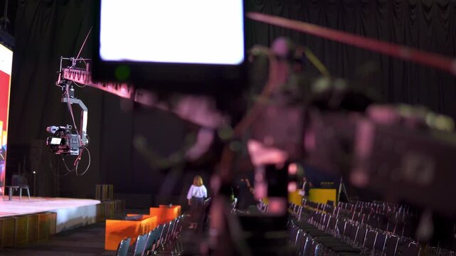 Professional camera crane broadcasting live event in studio