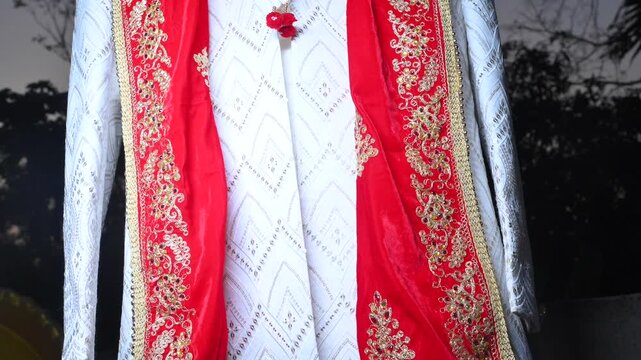 Traditional Indian Groom Wedding Attire with Sherwani, Turban and Mojari Display Before Marriage Ceremony