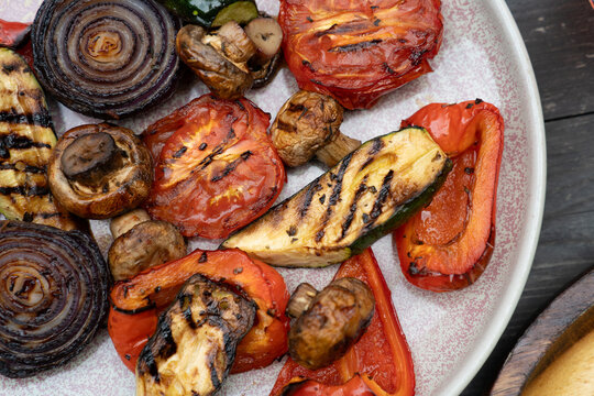 Close-up of freshly grilled vegetables served on a ceramic plate