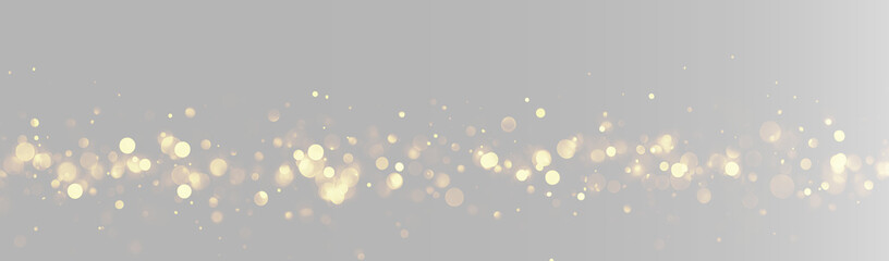 Abstract gold glitter horizontal line on grey background, glowing golden particles border © Maxim