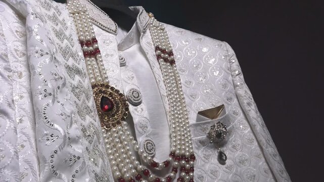 Traditional Indian Groom Wedding Attire with Sherwani, Turban and Mojari Display Before Marriage Ceremony