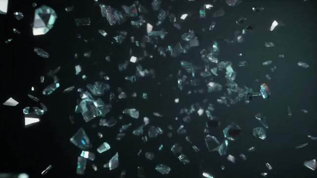 Shattered glass fragments suspended midair against a dark background, reflecting light with blue‑green highlights, symbolizing fragility, chaos, and the beauty of destruction in motion.