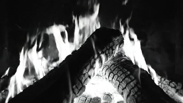 Cozy Black and White Fireplace with Burning Logs and Flames in Warm Interior for Relaxation and Comfort