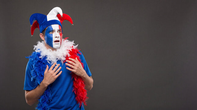 Emotional French Soccer Fan in Jester Costume Copy Space