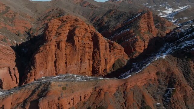 Drone footage of the Jeti Oguz Gorge and the Seven Bulls red sandstone cliffs, a famous landmark near Jeti Oguz village, Issyk Kul Region, Kyrgyzstan