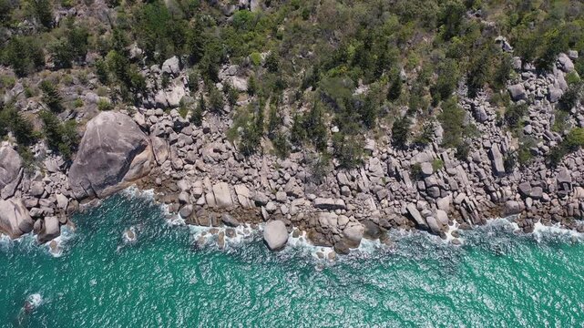 A drone view of rugged rocky coastline meeting turquoise waters at Good Ju Ju Lookout, Western Australia