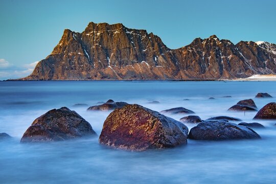 Winter coastal landscape with stormy sea, rocks, long exposure, Uttakleiv strand, Leknes, Nordland, Lofoten, Norway