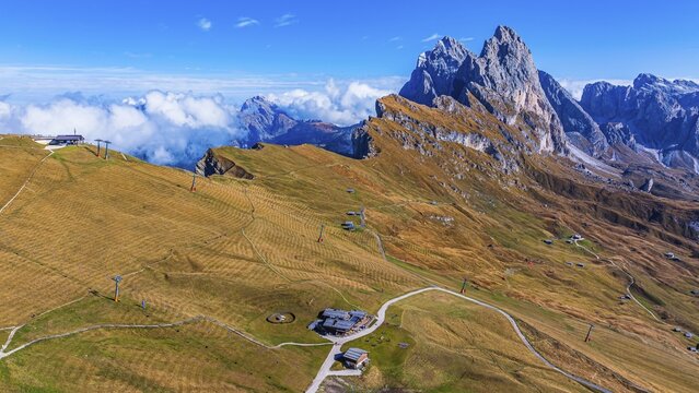 Sofie hut, behind the peaks Sas Rigais and Furchetta of the Geisler group, drone shot, Val Gardena, Dolomites, Autonomous Province of Bolzano, South Tyrol, Italy