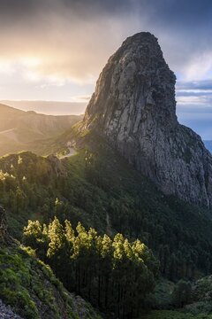 View of the Roque de Agando rock tower, one of La Gomera's landmarks, from the Mirador Roque de Agando. Sunrise, good weather. Monumento Natural de Los Roques, La Gomera, Canary Islands, Spain