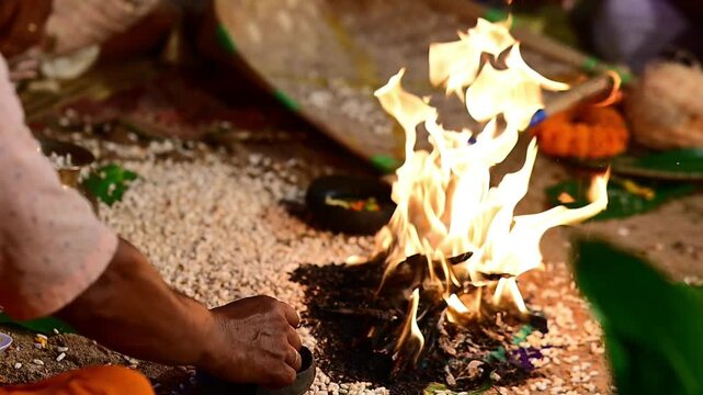 Close-up footage of a sacred Havan fire (Agni Kund) burning during a traditional Hindu wedding ceremony in India. The holy fire serves as a divine witness to the marriage and symbolizes purity.