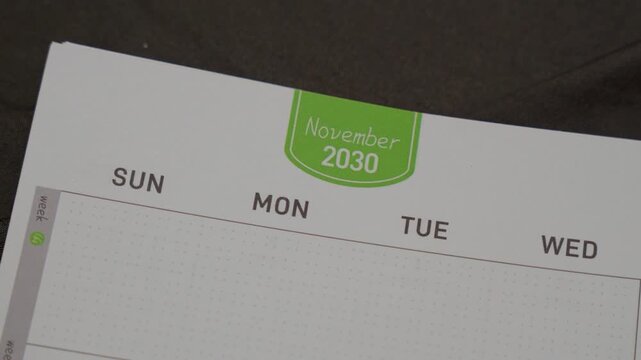 November 2030 planner page close up for monthly scheduling concept with calendar layout and time organization